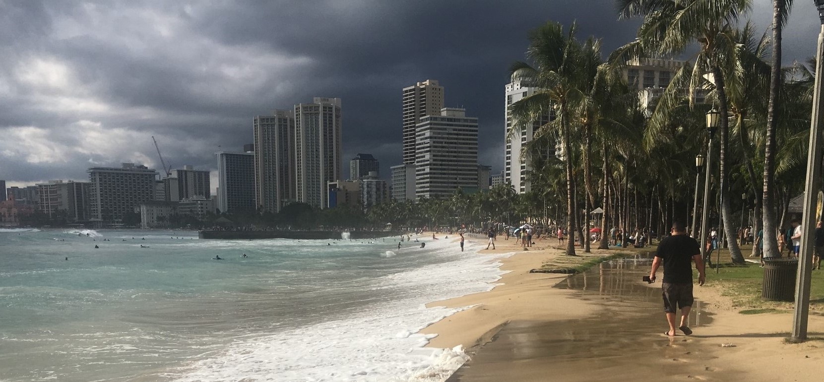 Very dark storm clouds arrive over Waikiki beach