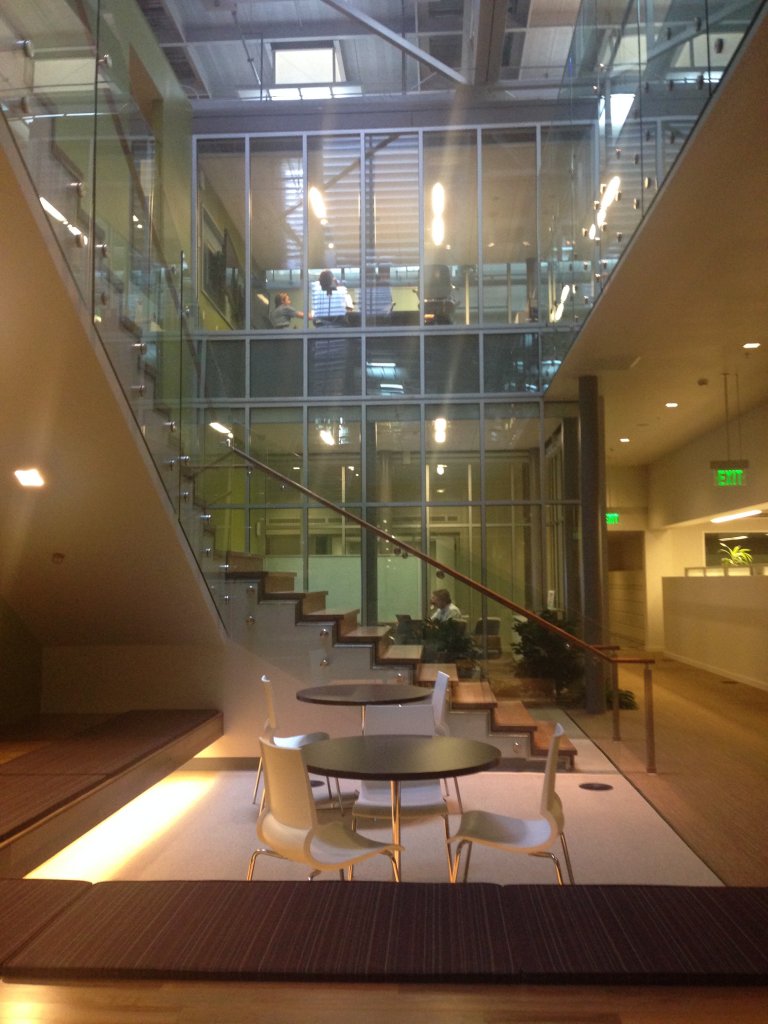 interior view of building, class and stairs, table and chairs