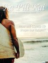 Cover of Ka Pili Kai, Dr. Kapono stands facing the surf, surfboard under his arm.