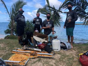 Hawai'i Marine Animal Response’s (HMAR) marine debris divers next to the debris they cleaned up during a SCUBA dive. Hawai'i Sea Grant is collaborating with Hawai'i Marine Animal Response’s Marine Debris Program to expand programmatic activities
