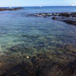 Shallow coastal waters in a rocky baylet show patterns of upwelling water