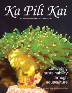 Cover of Ka Pili Kai magazie with close up image of yellow torch coral growing in a lab environment.